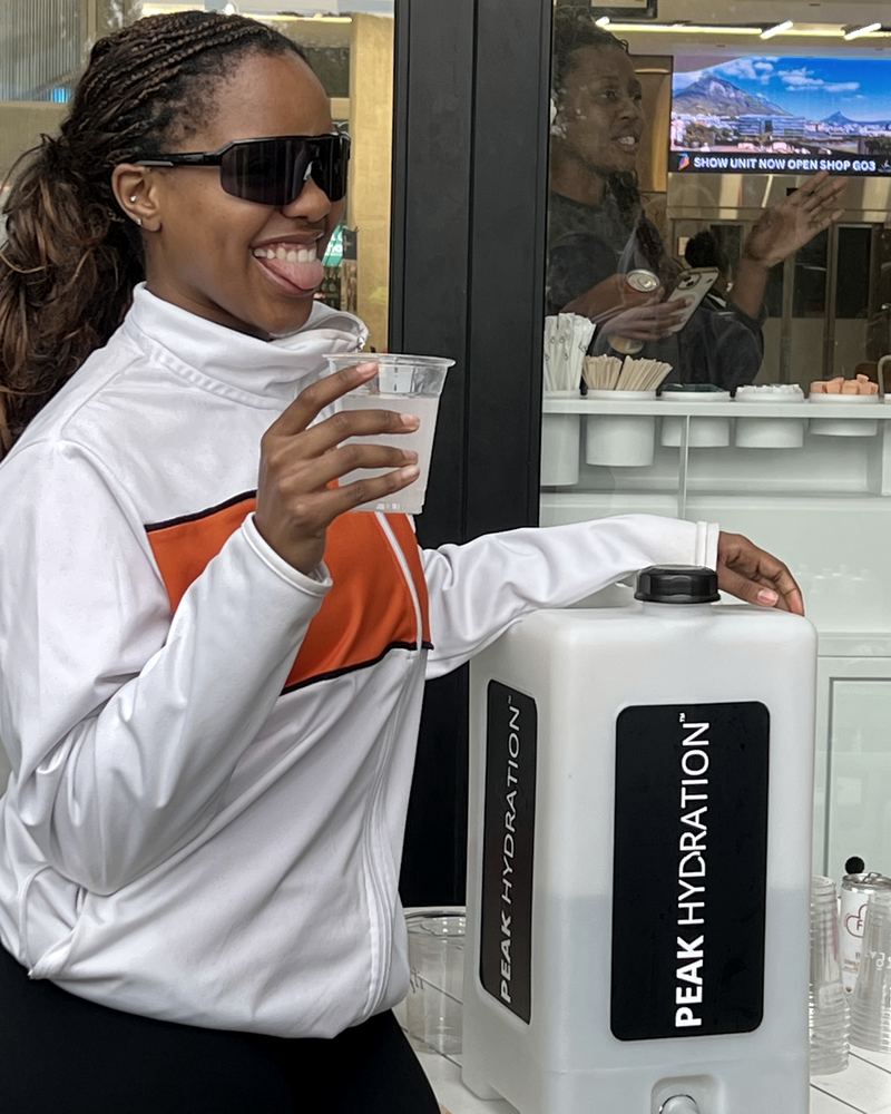 Enjoying Peak Hydration from a dispenser at an event