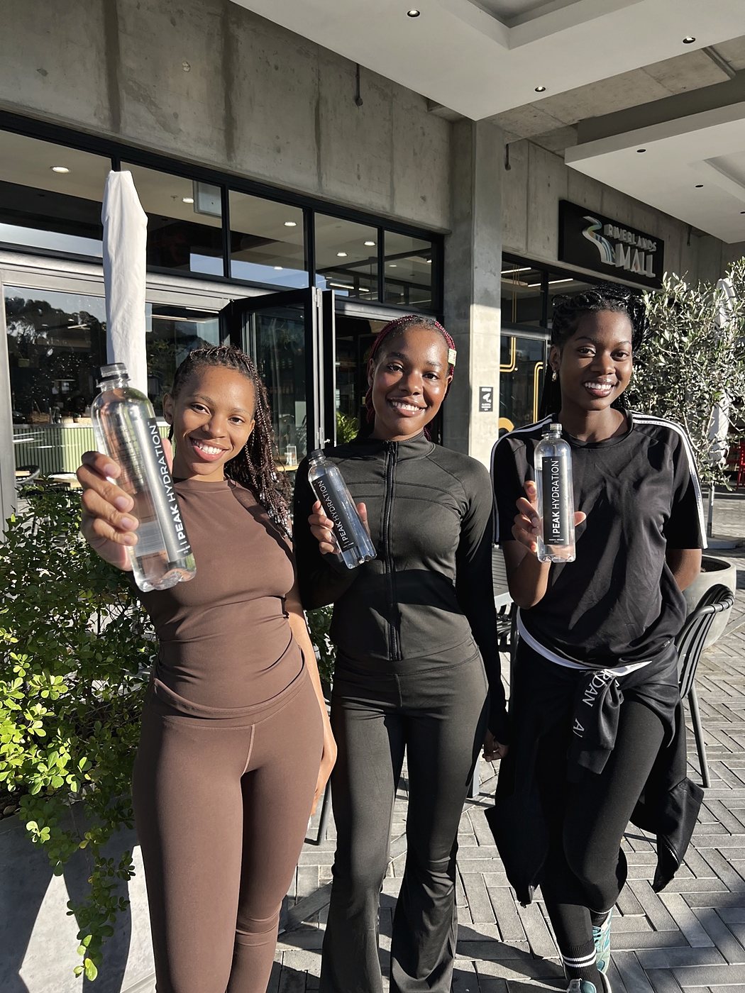 Three friends with Peak Hydration after a session