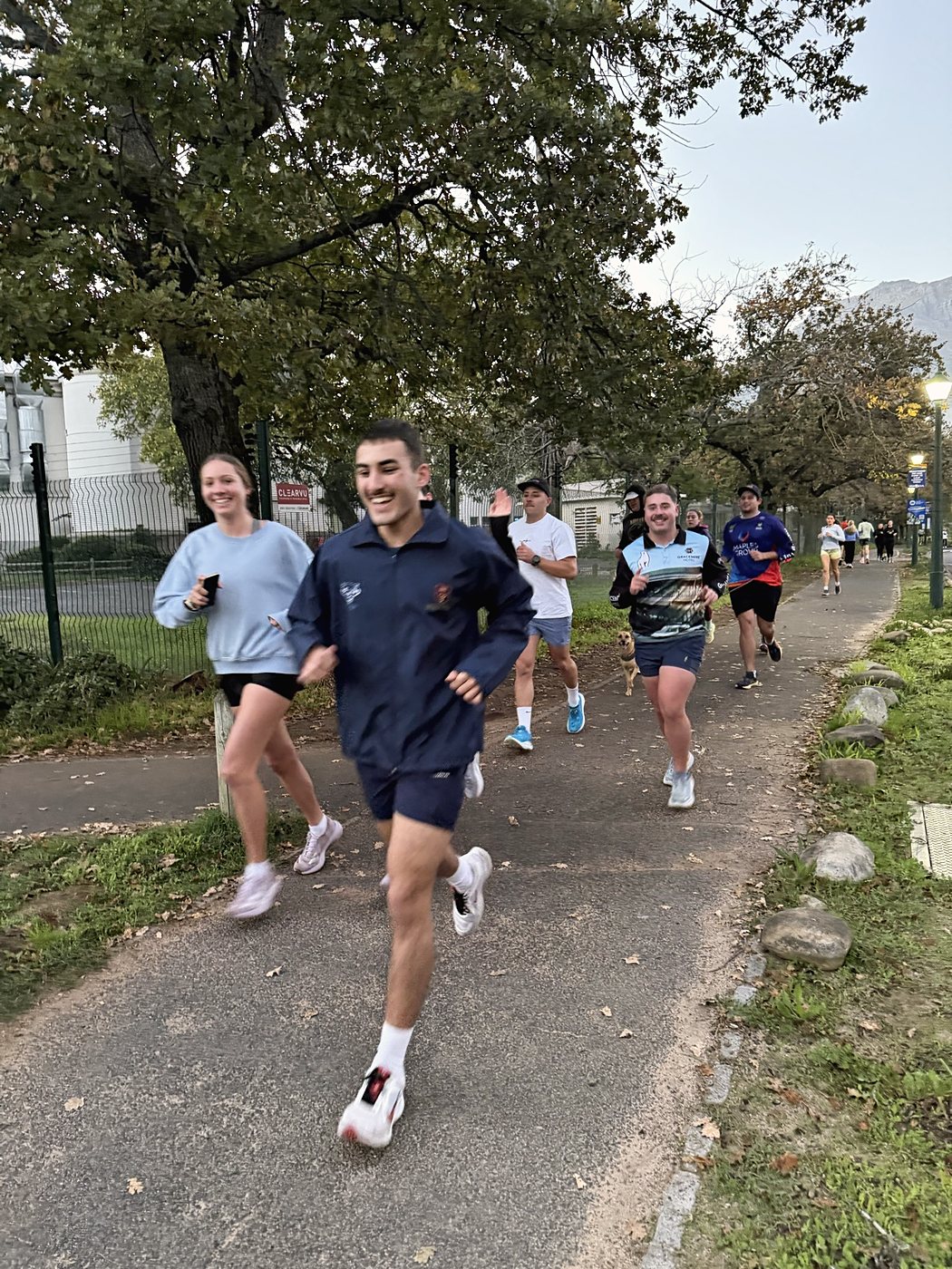 Runners mid-stride on a community run